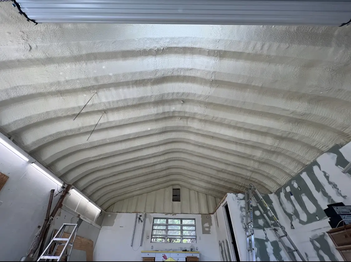 Spray polyurethane foam applied to the underside of a metal roof deck in Ives Estates